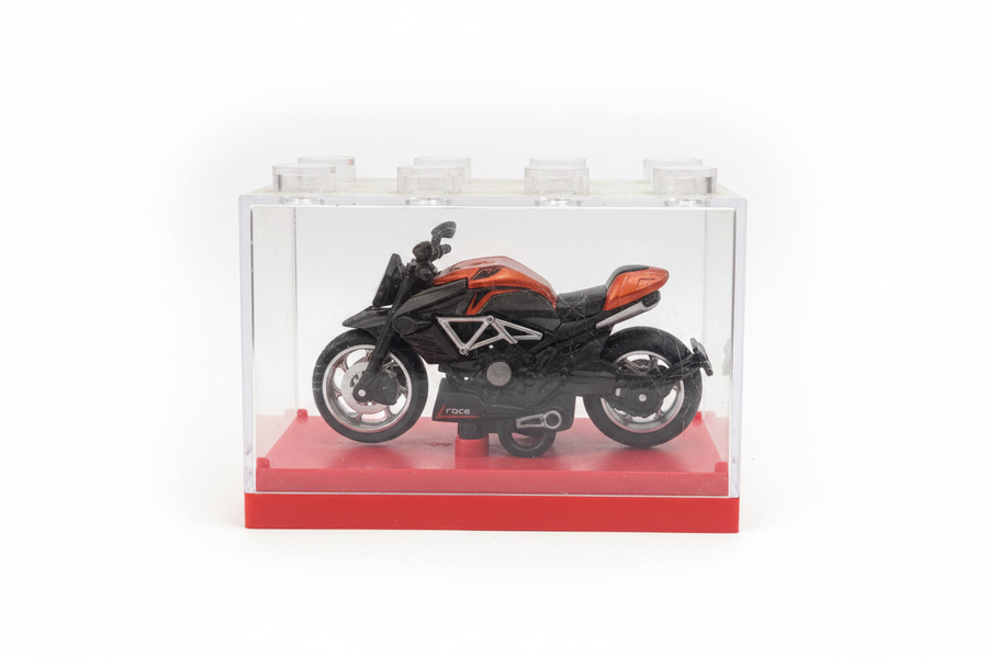 Orange black cruiser motorcycle in display box white background