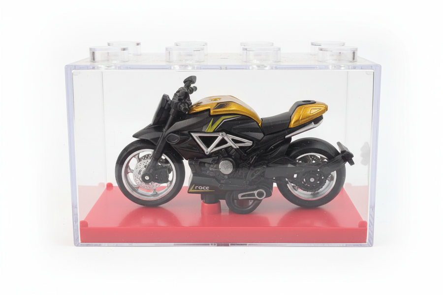 Gold black cruiser motorcycle in display box white background
