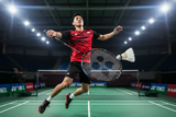 Player in action with Yonex Voltric Lite 40i badminton racket